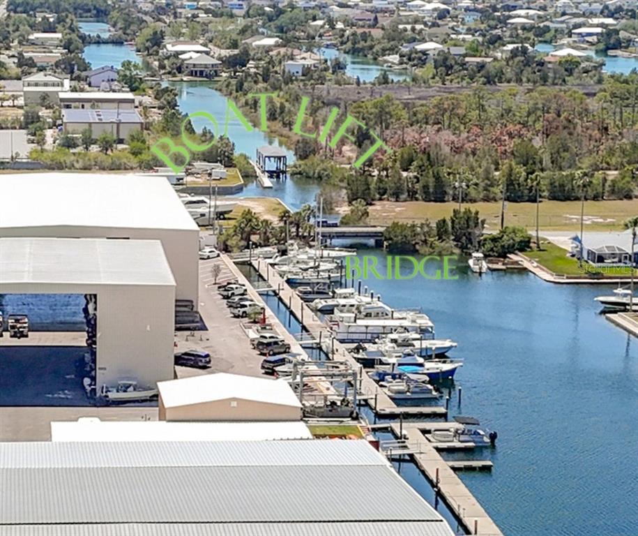 3377 Oleander Drive Hernando Beach, FL 34607 - Photo 20 of 22 an aerial view of residential houses with outdoor space