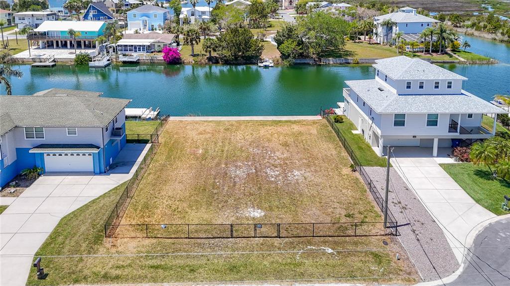 3377 Oleander Drive Hernando Beach, FL 34607 - Photo 4 of 22 an aerial view of a house with outdoor space and lake view