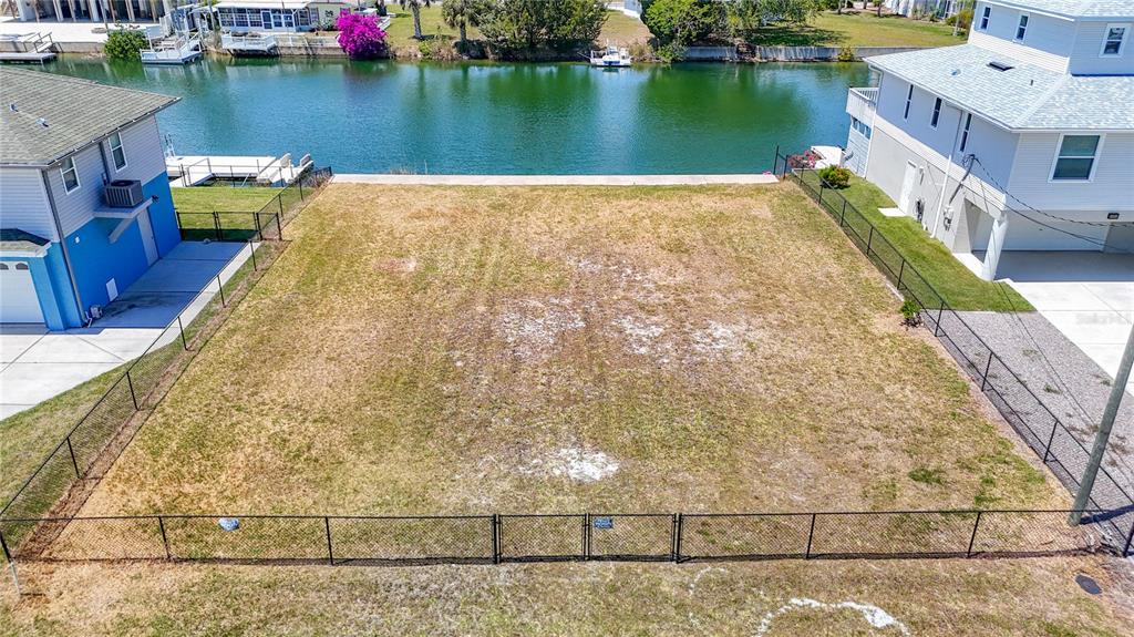 3377 Oleander Drive Hernando Beach, FL 34607 - Photo 5 of 22 a view of a lake with a building in the background