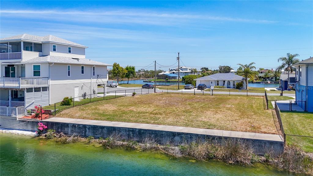 3377 Oleander Drive Hernando Beach, FL 34607 - Photo 6 of 22 a swimming pool with outdoor seating and yard