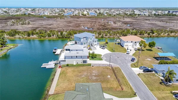 an aerial view of a house with a lake view