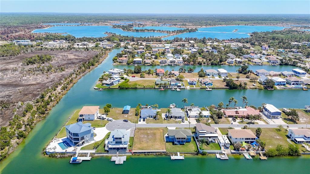 3377 Oleander Drive Hernando Beach, FL 34607 - Photo 10 of 22 an aerial view of a houses with outdoor space