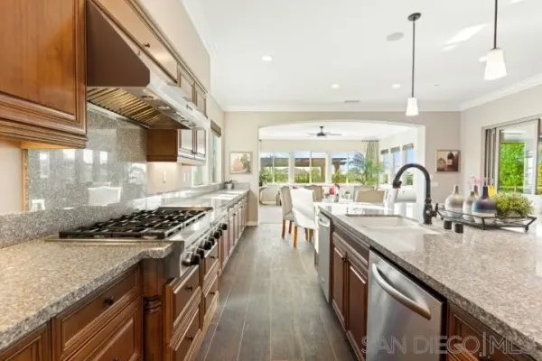 a living room with large windows and furniture