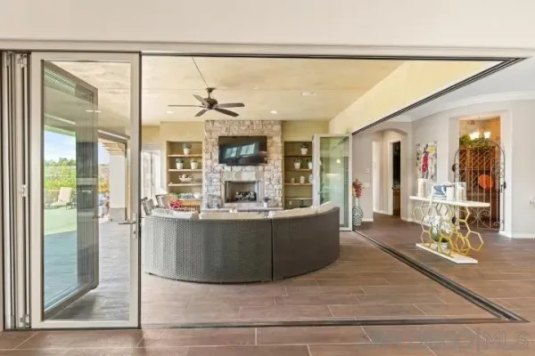 a bathroom with a granite countertop tub sink and mirror
