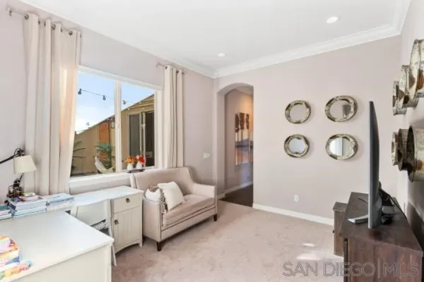a living room with fireplace furniture and a flat screen tv