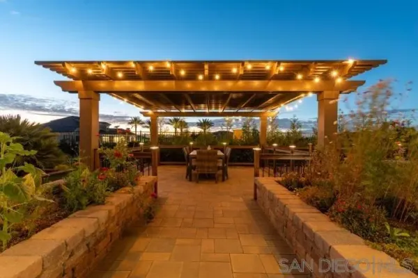 a view of a patio with a table chairs and a backyard