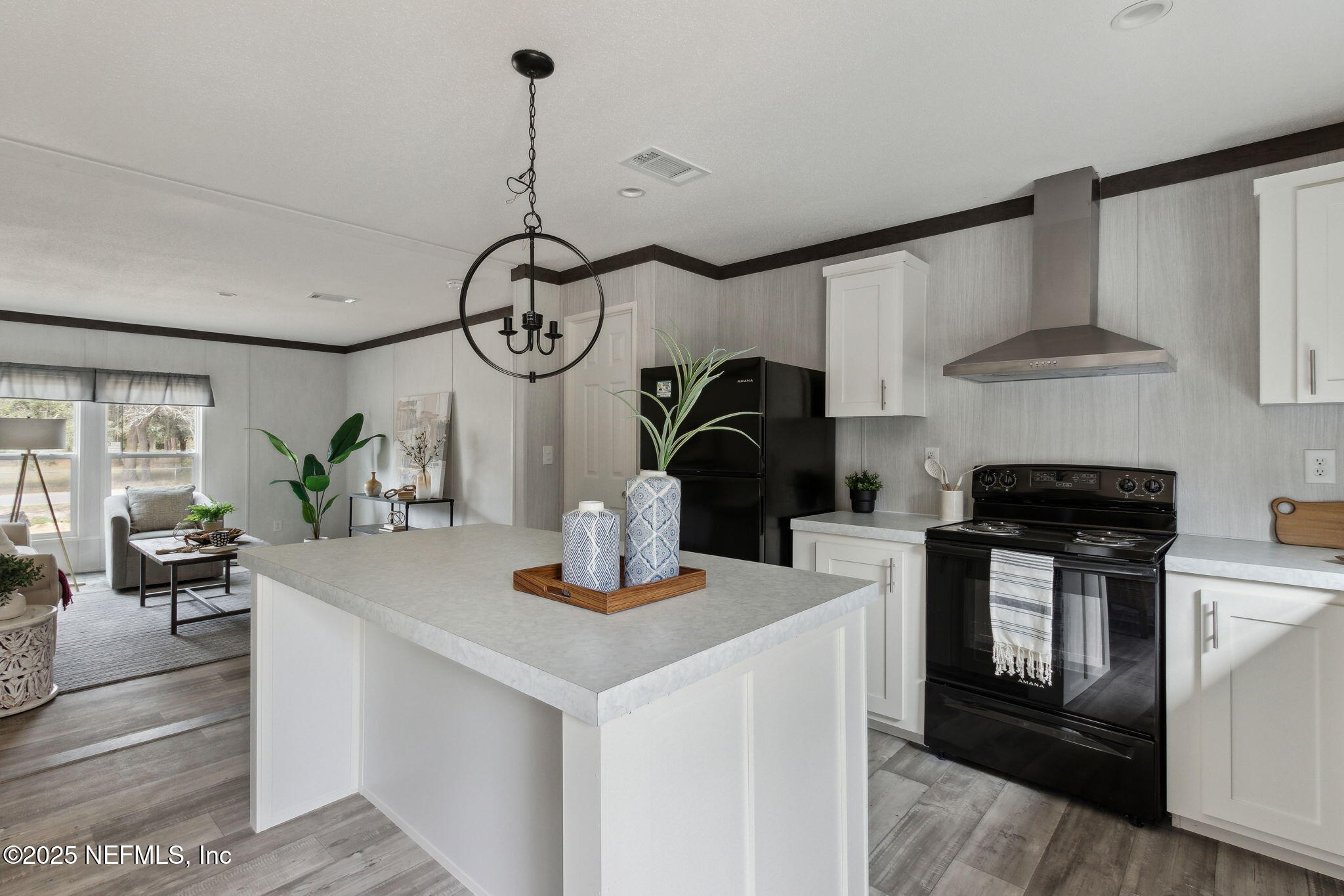 87454 Haven Road Yulee, FL 32097 - Photo 12 of 38 a kitchen with stainless steel appliances granite countertop a sink a stove and a wooden floors