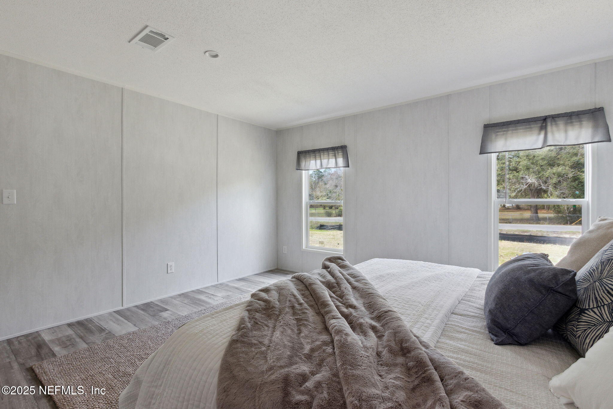 87454 Haven Road Yulee, FL 32097 - Photo 15 of 38 a bedroom with a bed window and a window