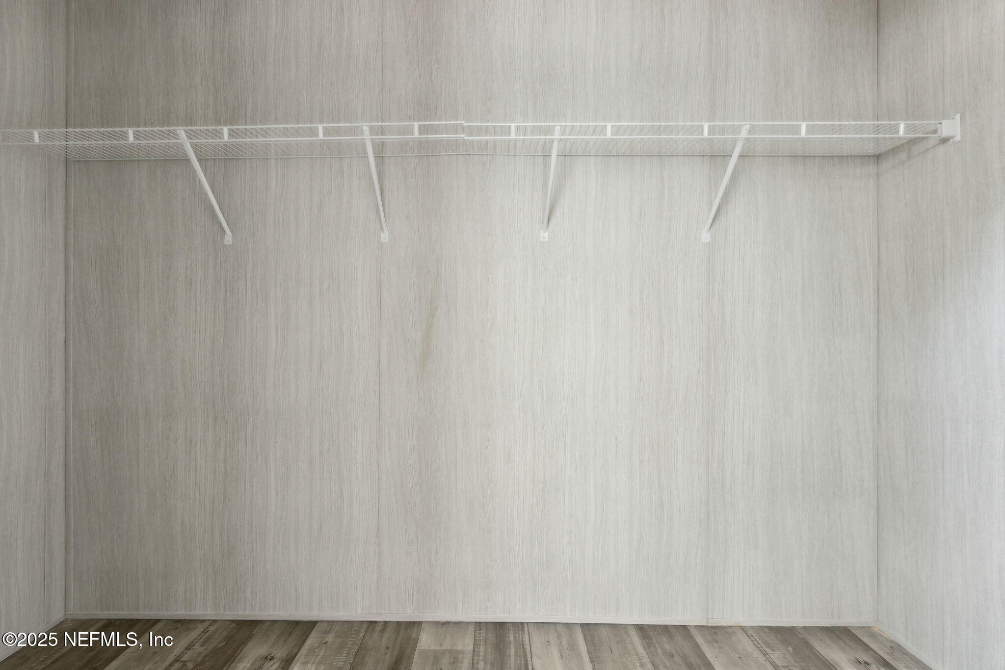87454 Haven Road Yulee, FL 32097 - Photo 19 of 38 a view of a room with racks on the wall