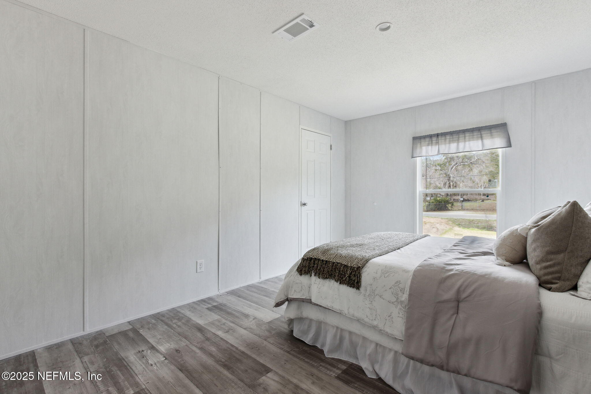 87454 Haven Road Yulee, FL 32097 - Photo 23 of 38 a bedroom with a bed and window