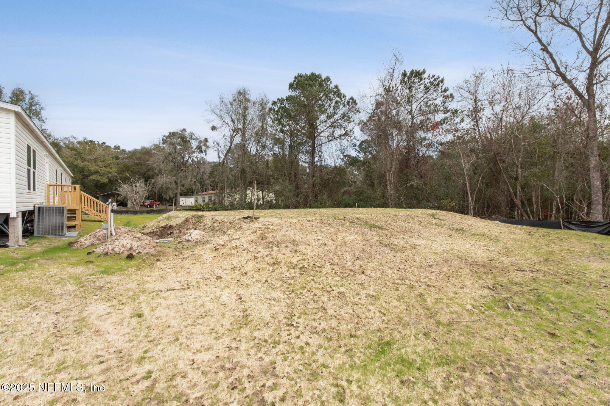 87454 Haven Road Yulee, FL 32097 - Photo 38 of 38 a backyard of a house with large trees