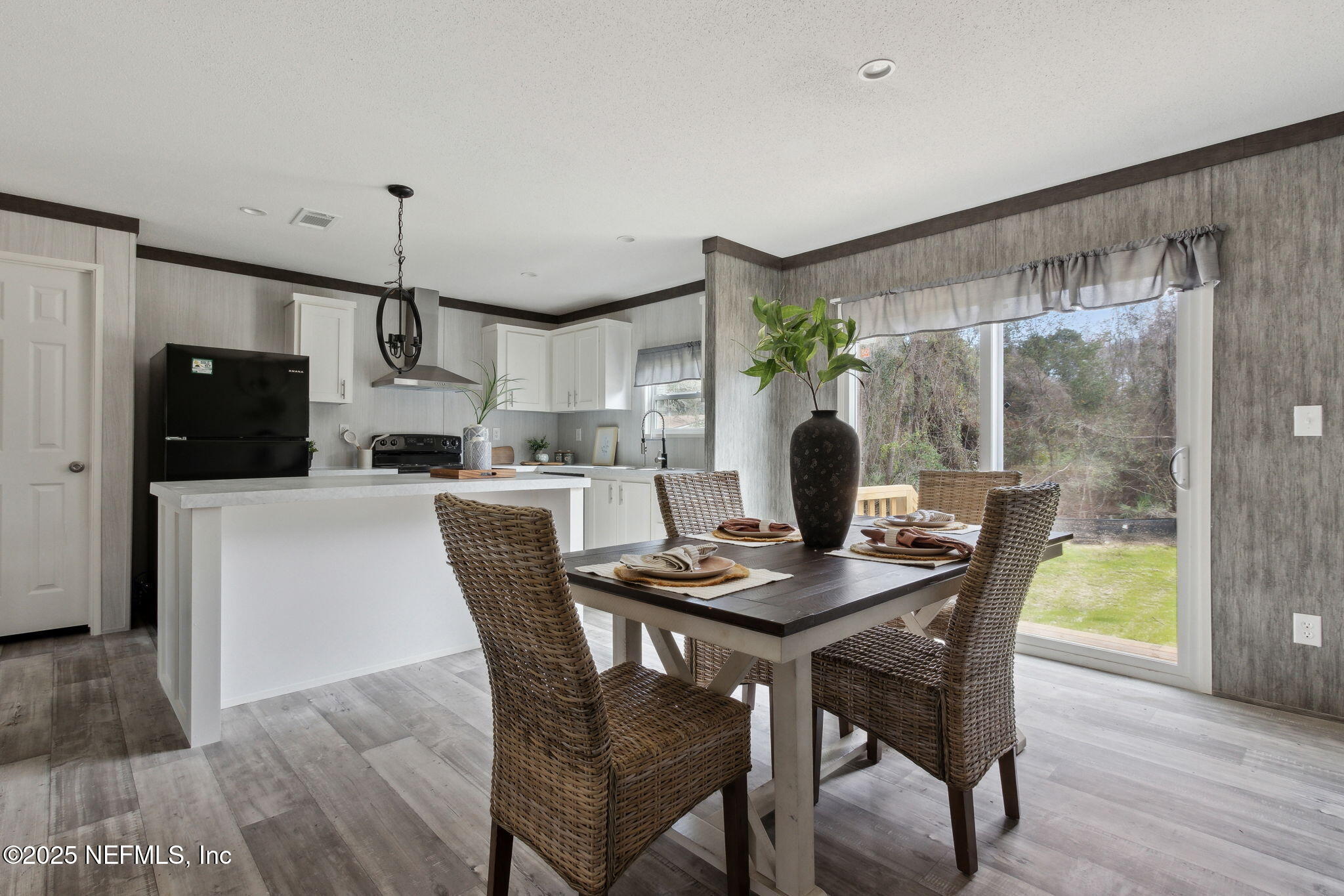 87454 Haven Road Yulee, FL 32097 - Photo 8 of 38 a dining room with furniture and window