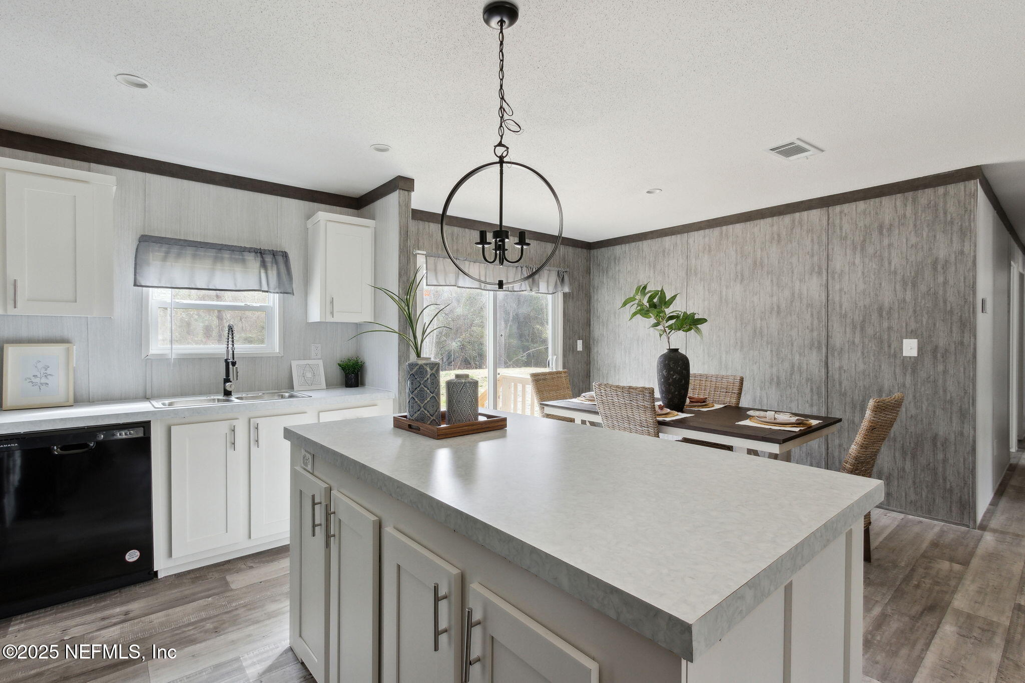 87454 Haven Road Yulee, FL 32097 - Photo 9 of 38 a kitchen with a sink a stove and cabinets