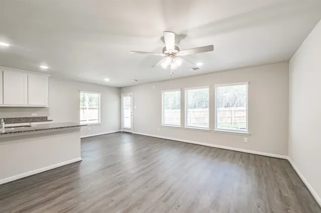 a view of kitchen with cabinet and refrigerator
