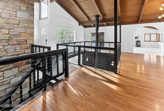 a kitchen with stainless steel appliances kitchen island granite countertop a stove and white cabinets