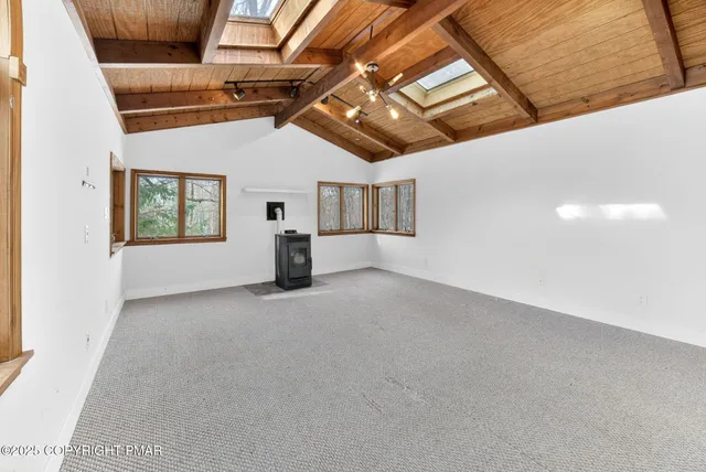 a view of empty room with windows