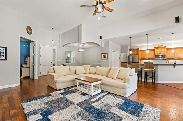 a kitchen with a sink a counter top space and cabinets