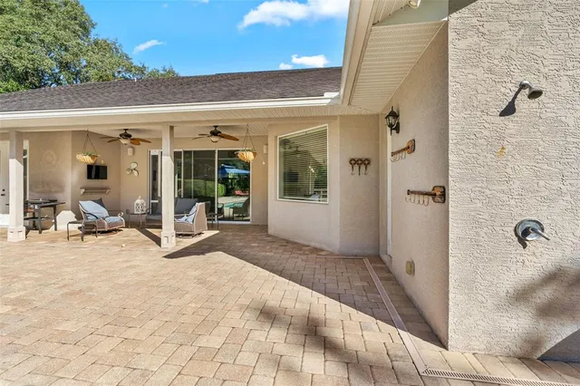 a spacious bathroom with a granite countertop sink a mirror and a shower