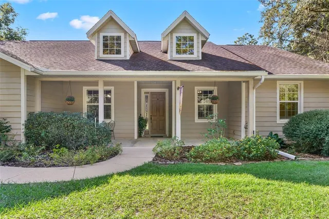 a view of a room with wooden floor and outdoor space