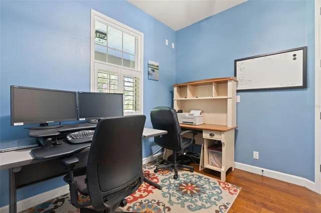 a view of a park with a bench and trees