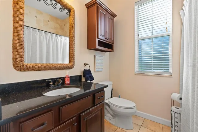 a view of a house with backyard and porch