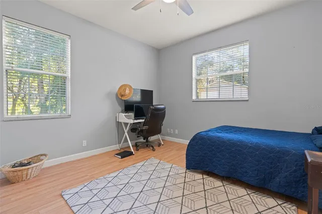 a kitchen with granite countertop a stove a sink and a refrigerator