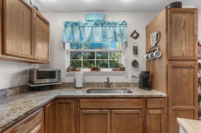an aerial view of a house with yard swimming pool and outdoor seating