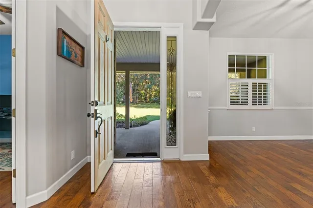 a large kitchen with stainless steel appliances granite countertop a stove a sink and a refrigerator