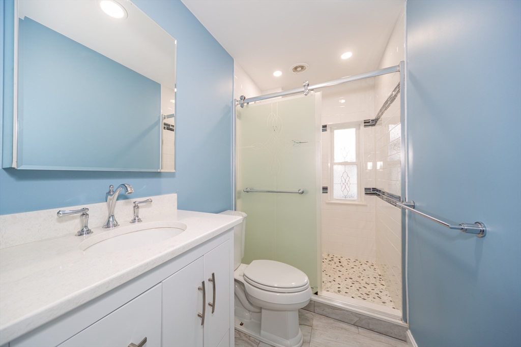 13 Union Street, Unit 13 Needham, MA 02494 - Photo 13 of 19 a bathroom with a sink toilet and shower