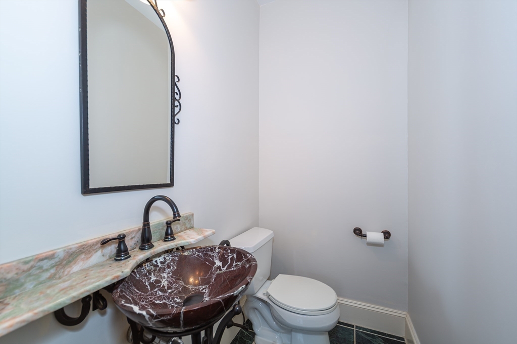 13 Union Street, Unit 13 Needham, MA 02494 - Photo 16 of 19 a bathroom with a sink a toilet and a mirror