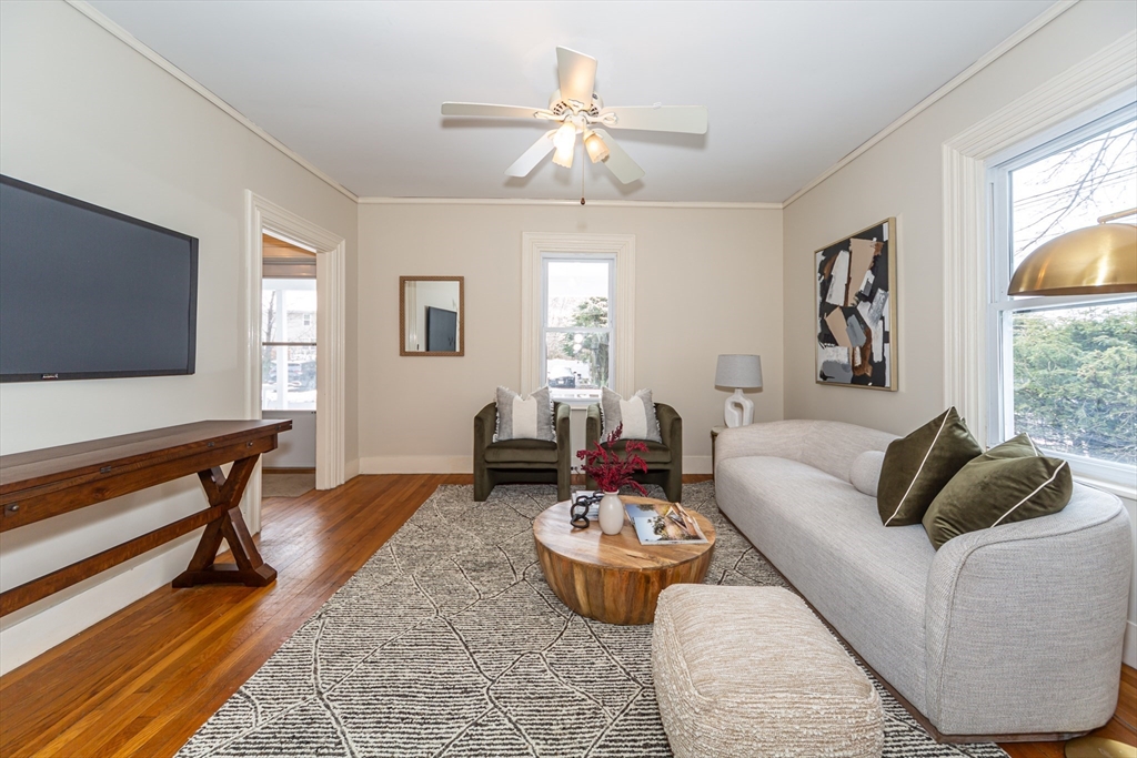 13 Union Street, Unit 13 Needham, MA 02494 - Photo 3 of 19 a living room with furniture and a flat screen tv