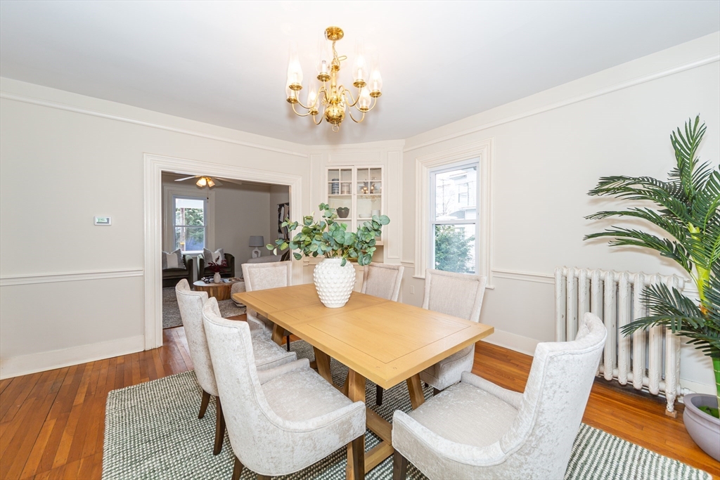 13 Union Street, Unit 13 Needham, MA 02494 - Photo 4 of 19 a view of a dining room with furniture and chandelier