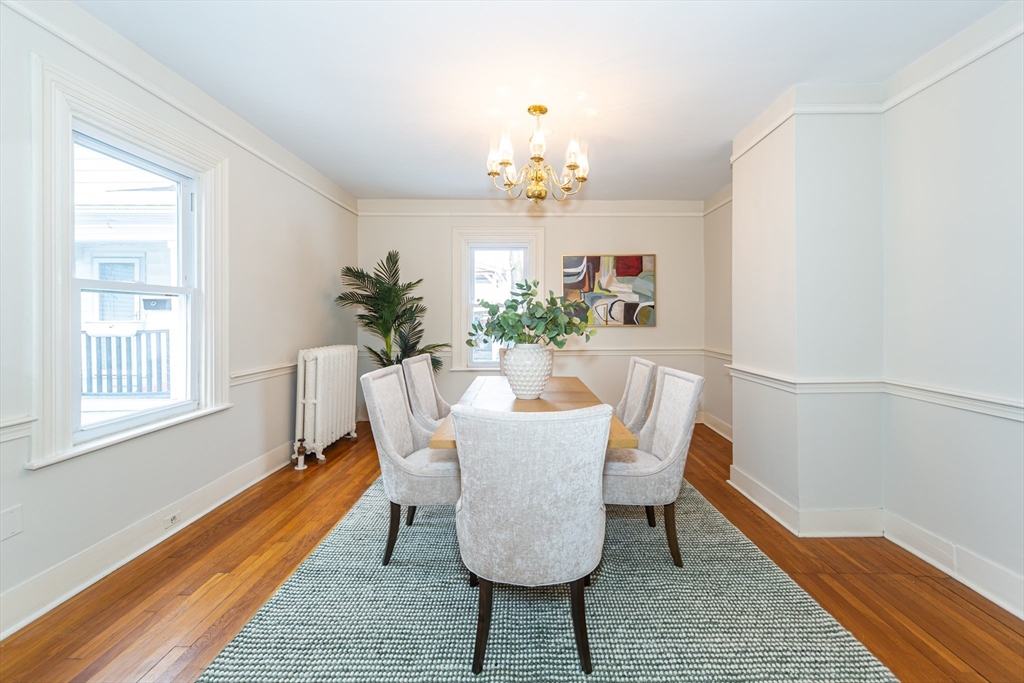 13 Union Street, Unit 13 Needham, MA 02494 - Photo 5 of 19 a dining room with furniture a rug and wooden floor