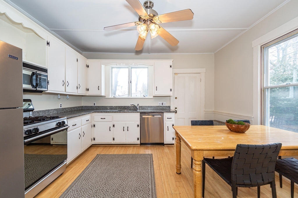 13 Union Street, Unit 13 Needham, MA 02494 - Photo 6 of 19 a kitchen with a stove a sink and a refrigerator