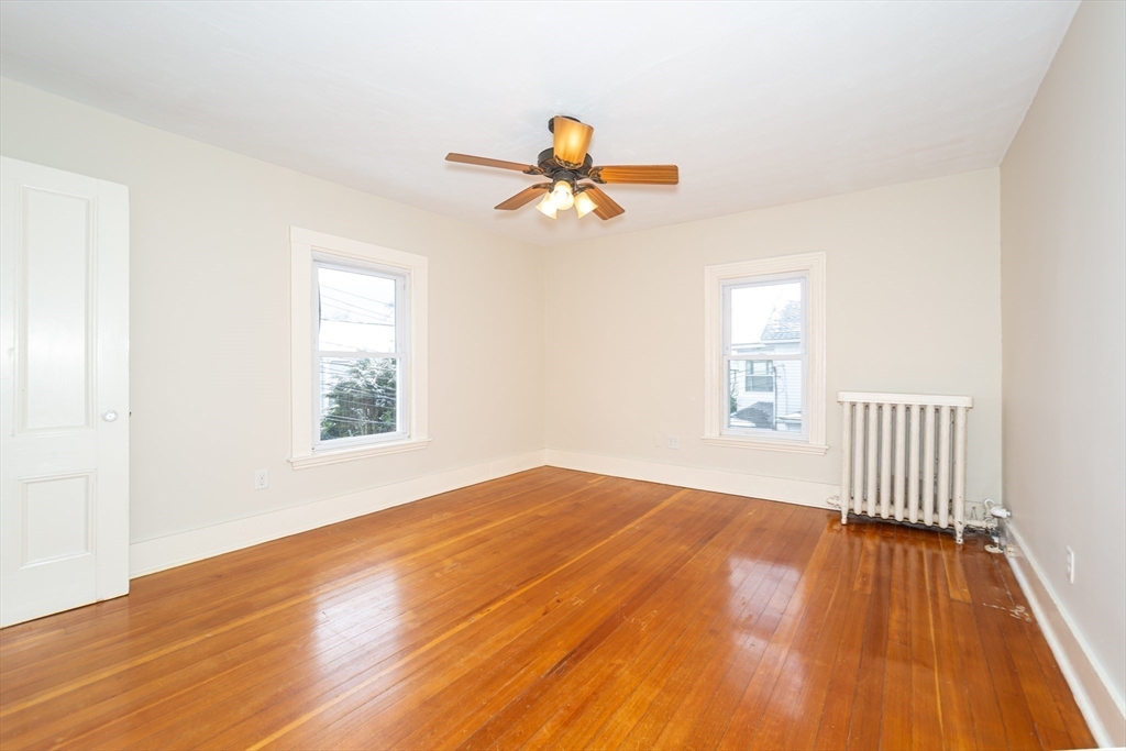 13 Union Street, Unit 13 Needham, MA 02494 - Photo 9 of 19 a view of empty room with wooden floor