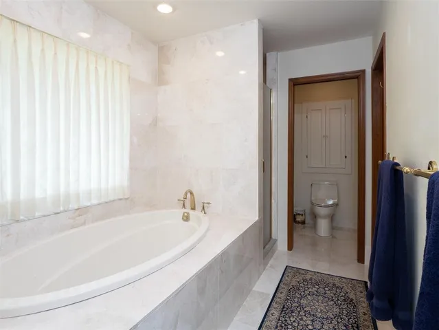 a bathroom with a toilet and a sink