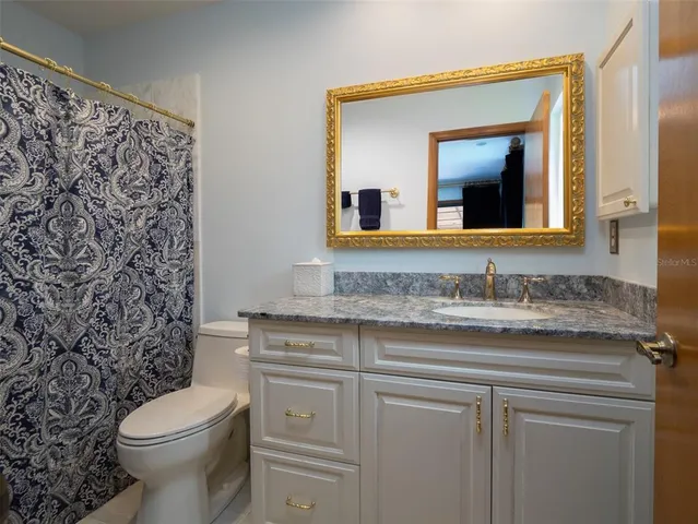 a front view of a house with yard and porch