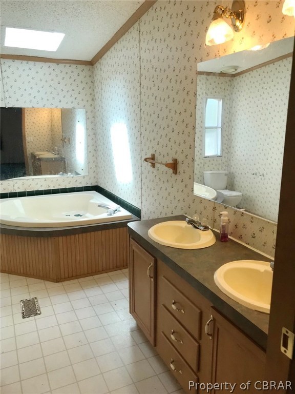 1357 Healys Road Locust Hill, VA 23092 - Photo 10 of 13 Master bath with soaker tub and double vanity.