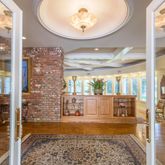 a very nice looking dining room with a table and chairs