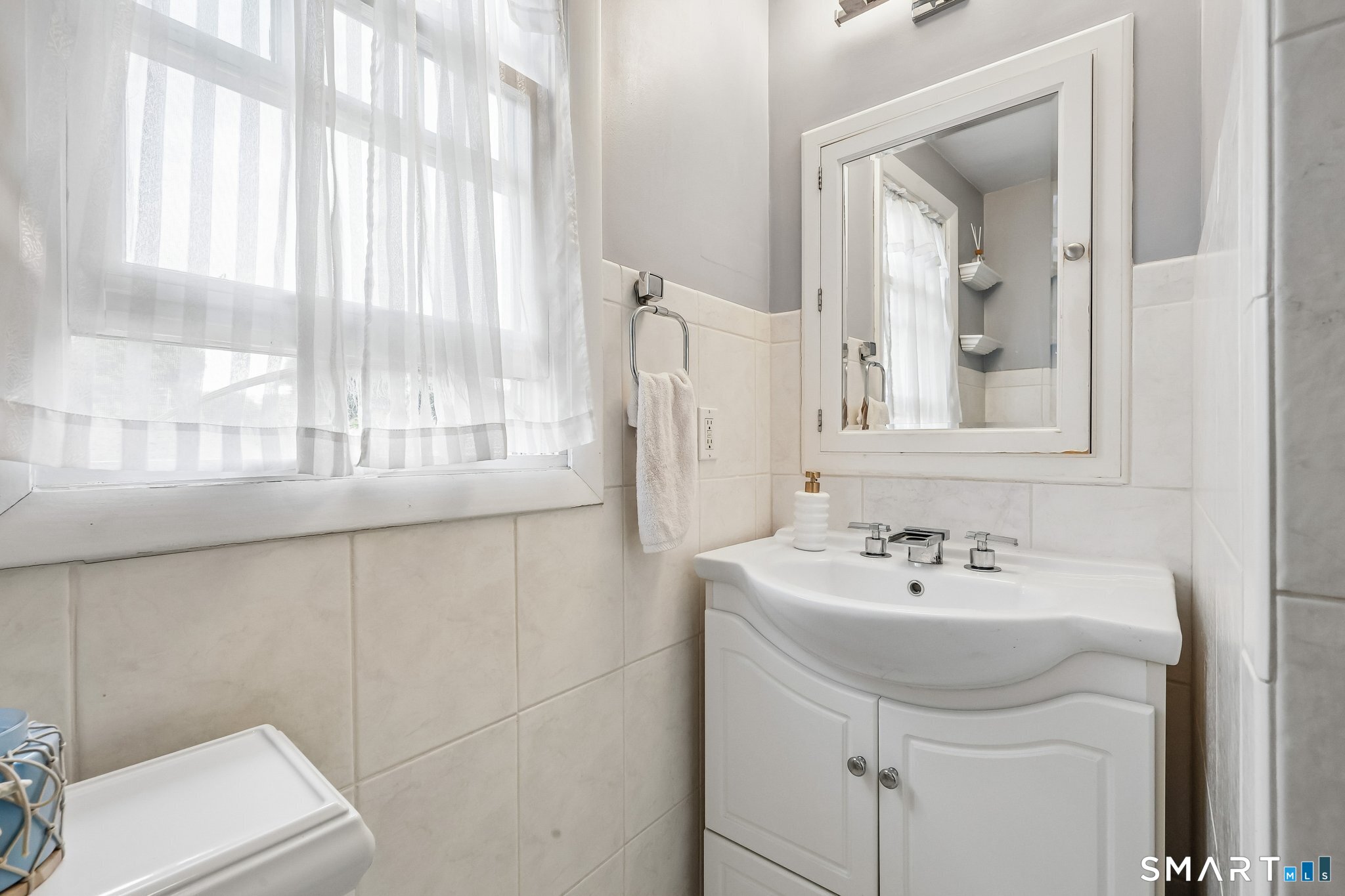 21 Friendly Road Norwalk, CT 06851 - Photo 17 of 28 Located on upper level next to Primary Bedroom, this bathroom is updated and includes a tub/shower combination.