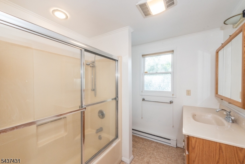 20 Wanaque Road West Milford, NJ 07421 - Photo 13 of 31 a bathroom with a sink and shower