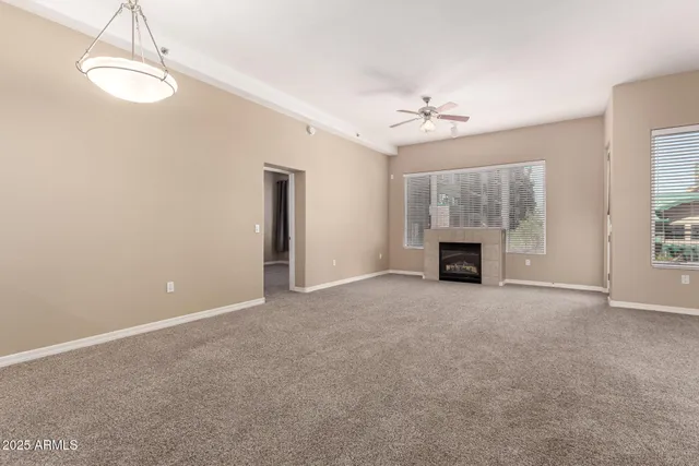 a view of an empty room with a fireplace