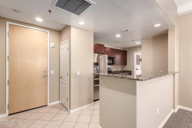 a kitchen with a sink and a refrigerator