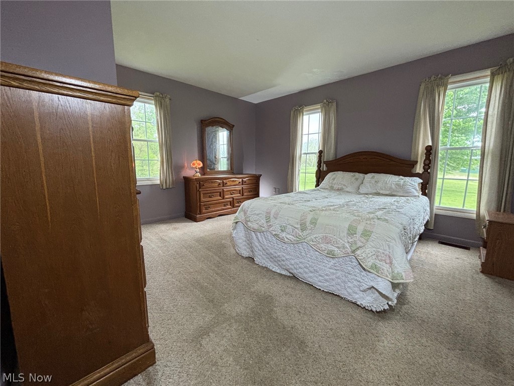 57575 Marietta Road Byesville, OH 43723 - Photo 11 of 25 Spacious room featuring neutral carpeting and lavender walls