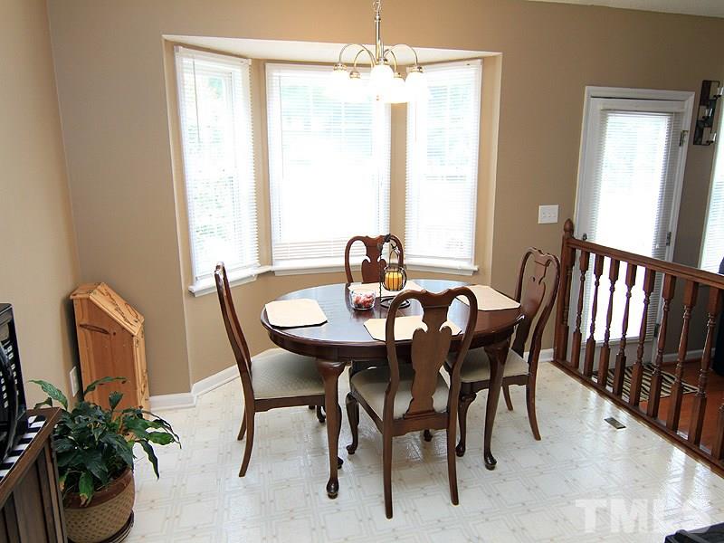 4009 Rockside Hills Drive Raleigh, NC 27603 - Photo 13 of 25 a view of a dining room with furniture and window