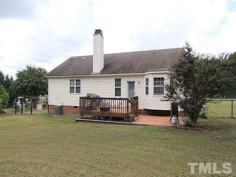 4009 Rockside Hills Drive Raleigh, NC 27603 - Photo 22 of 25 a front view of a house with a patio