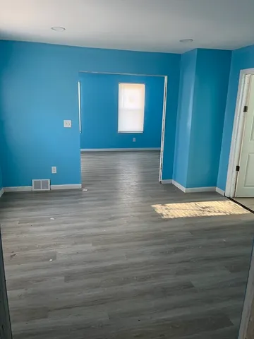 a view of a livingroom with wooden floor