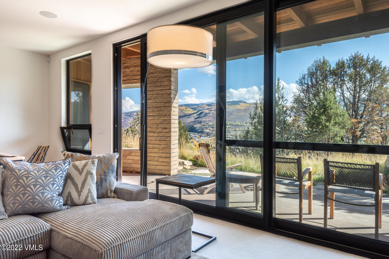 94 Juniper Lane Edwards, CO 81632 - Photo 22 of 31 a living room with furniture and a large window