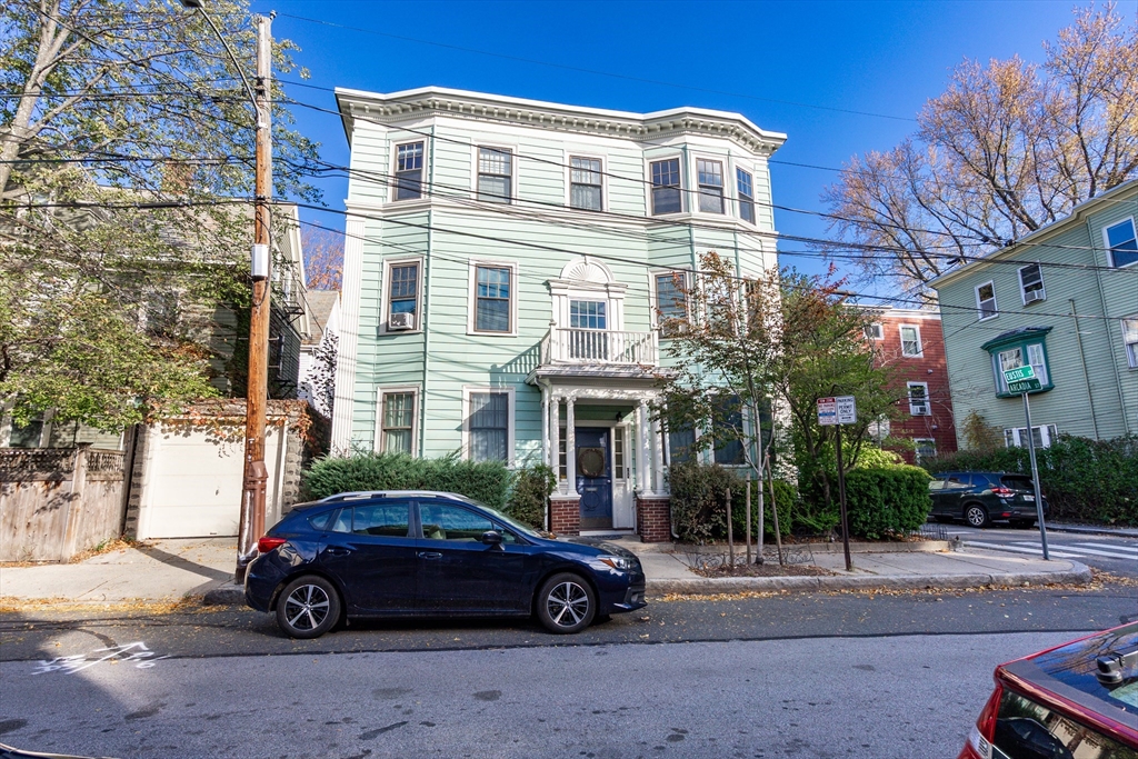25 Eustis Street, Unit 1 Cambridge, MA 02140 - Photo 1 of 14 a car parked in front of a building