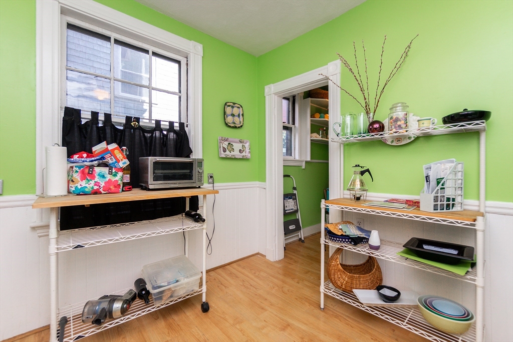 25 Eustis Street, Unit 1 Cambridge, MA 02140 - Photo 12 of 14 a room with furniture and a wooden floor